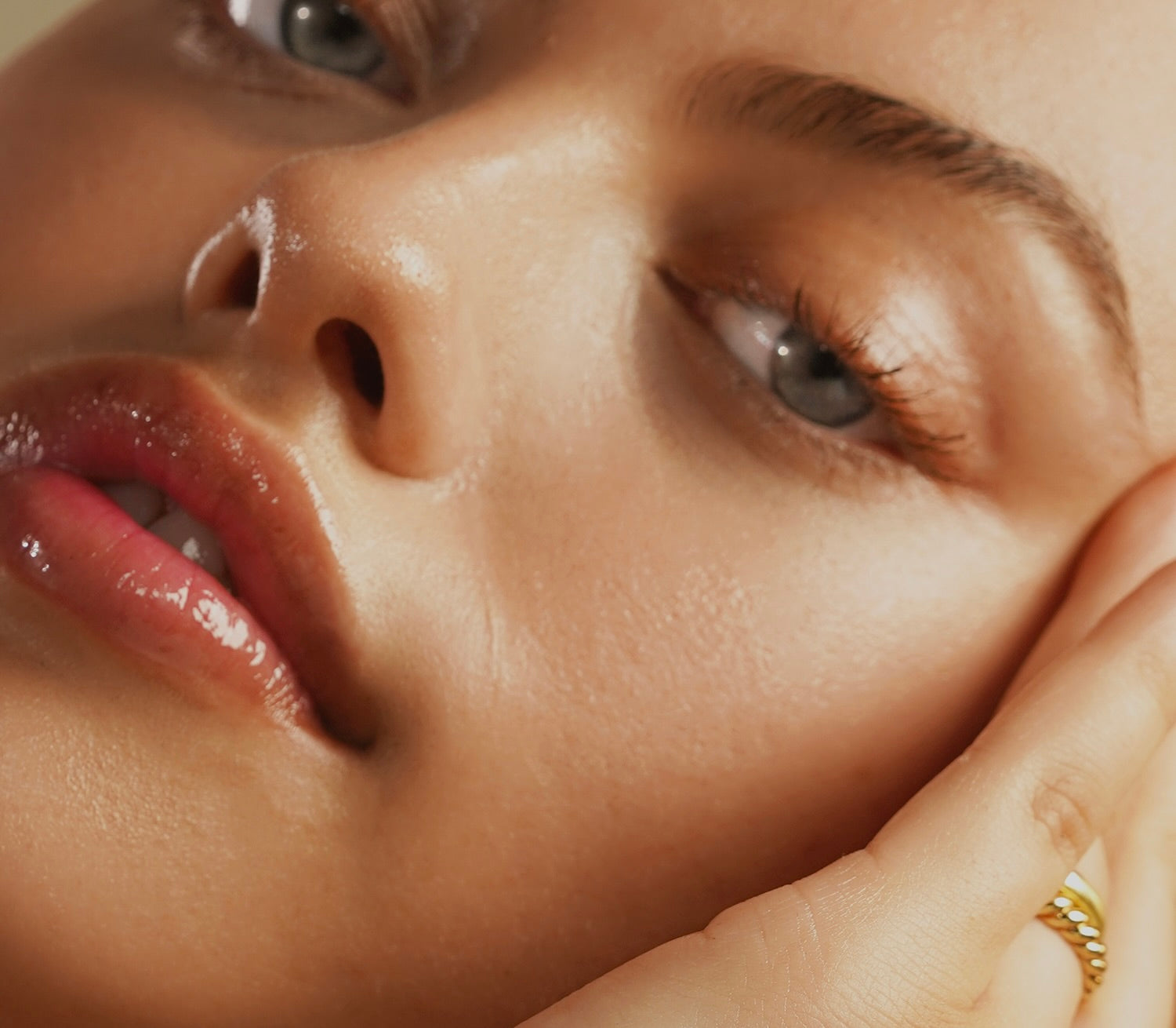 This image features a close-up of radiant, dewy skin, emphasizing hydration and a healthy glow. The focus on smooth texture and luminous complexion perfectly aligns with True Botanicals' commitment to effective, nourishing skincare.